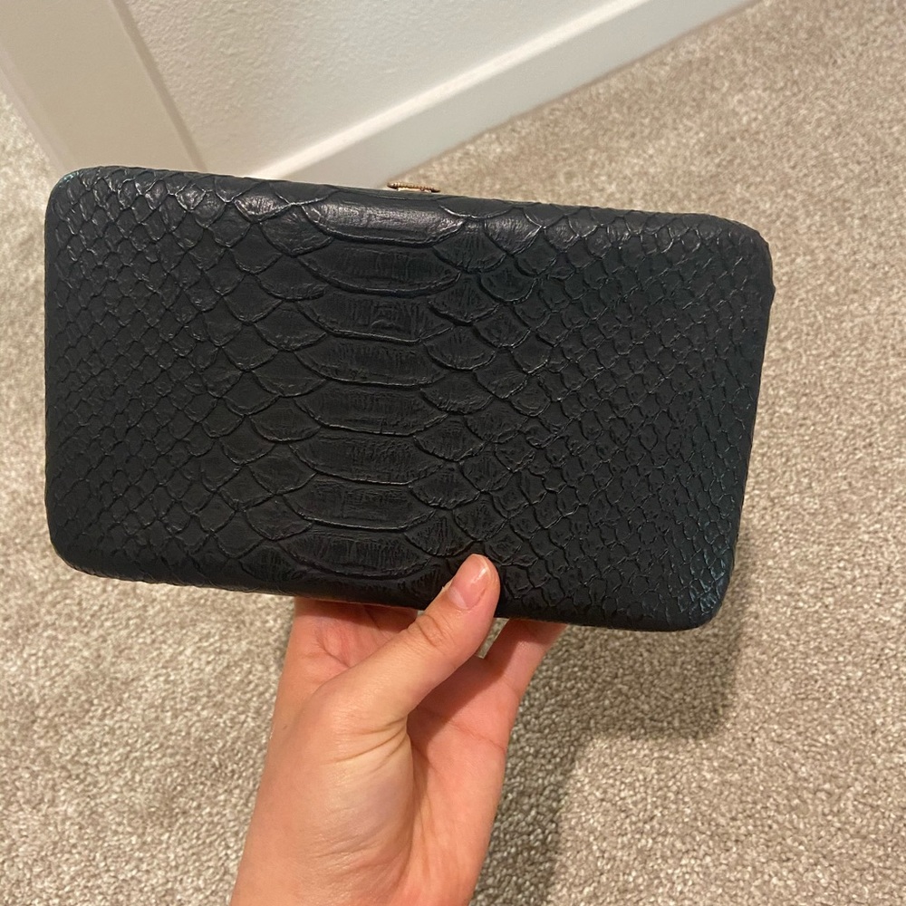 Black faux snake skin clutch
